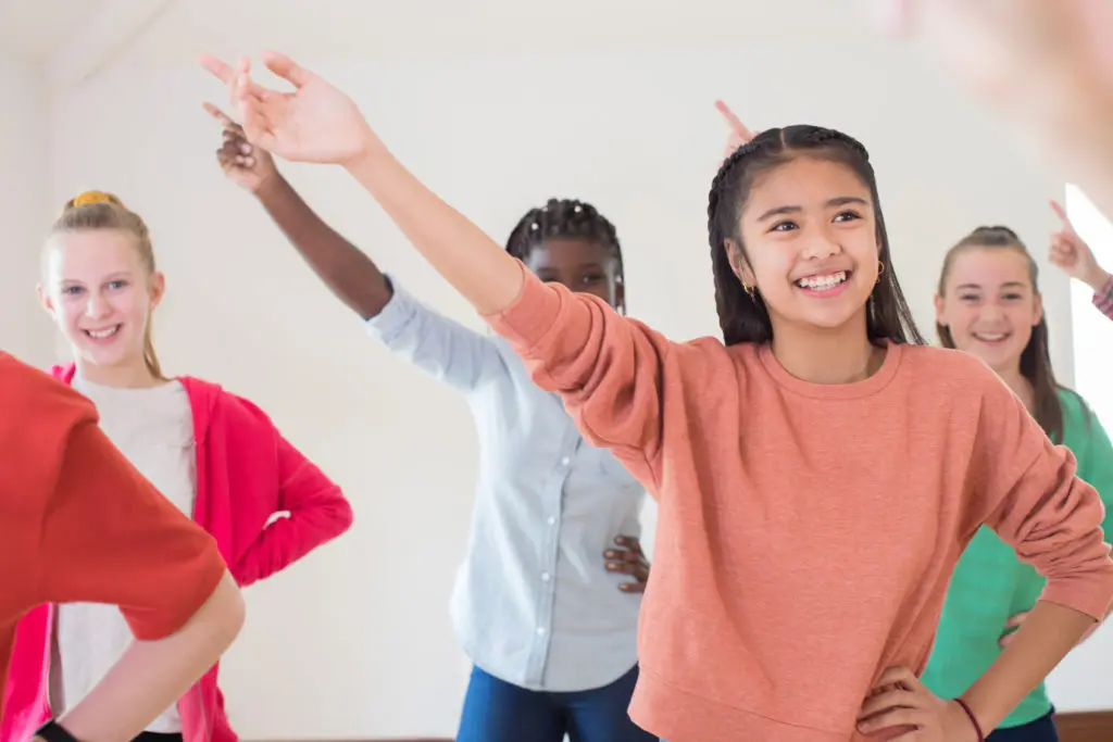 Group Of Children Enjoying practicing for a musical Together