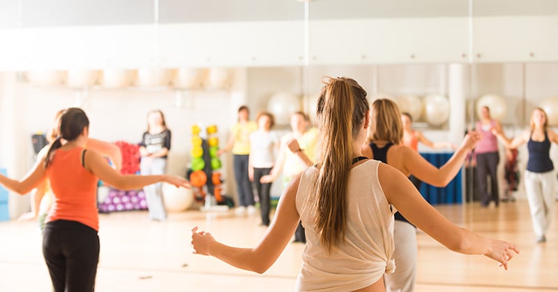 BACKS OF GIRLS DANCING IN STUDIO