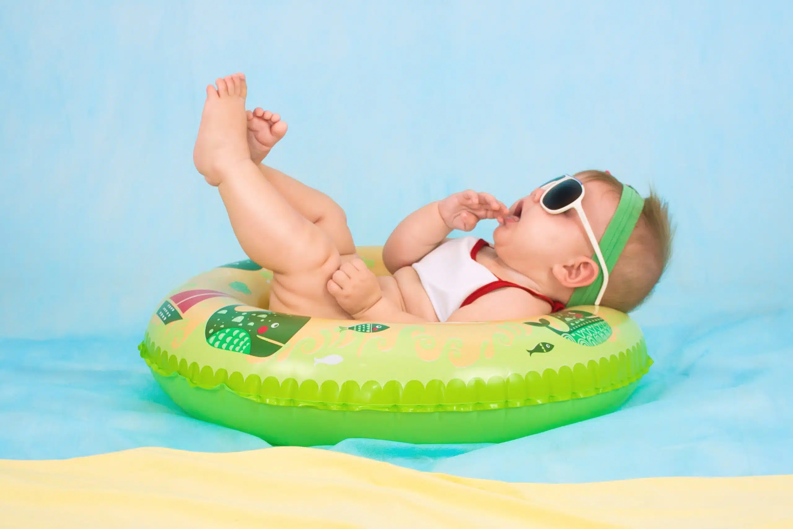 a baby floating in a plastic swimming tube