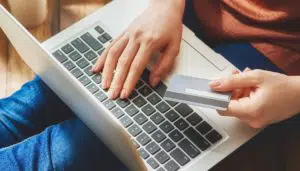 a person paying on a computer