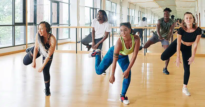 Dance instructor teaching adult class