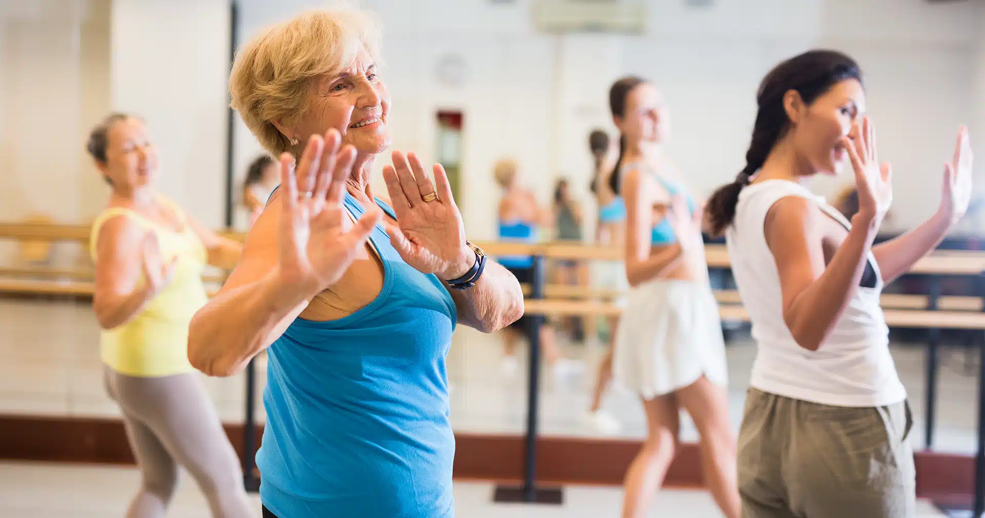 Four women dance in studio