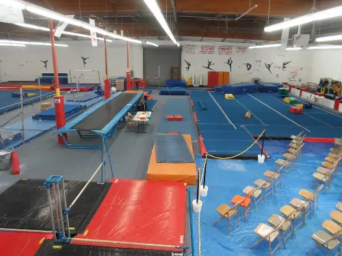 a gymnastics gym with equipment in it