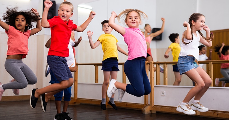 Kids jump in a dance class
