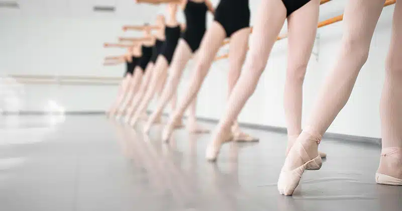 LINE OF BALLET STUDENTS AT BARRE