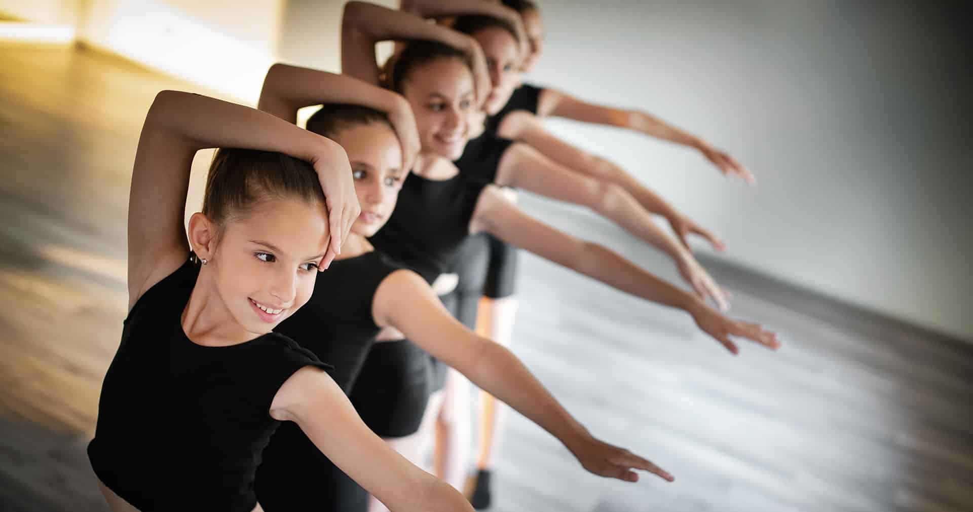 Row of little girls in dance class