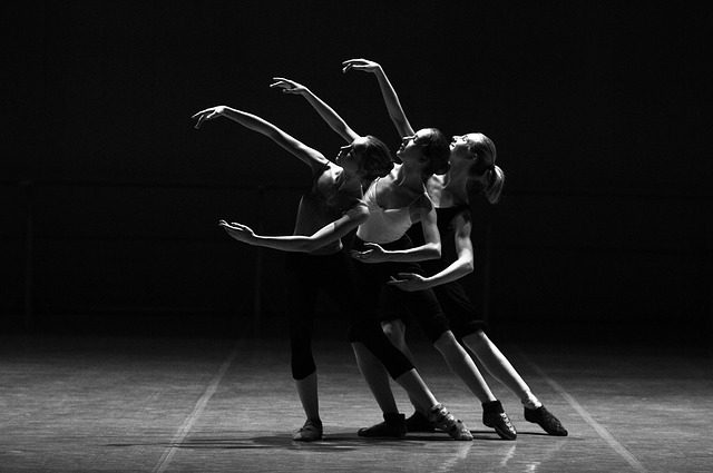 ballet dances performing on a stage