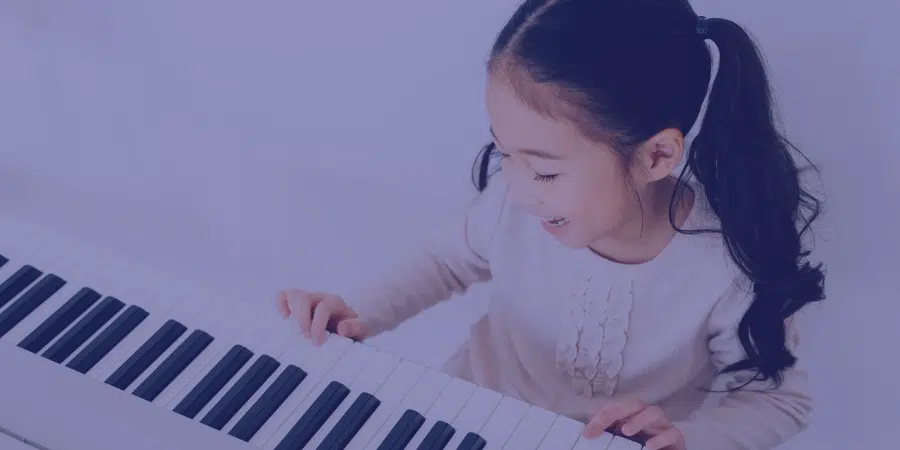 a young child playing the piano