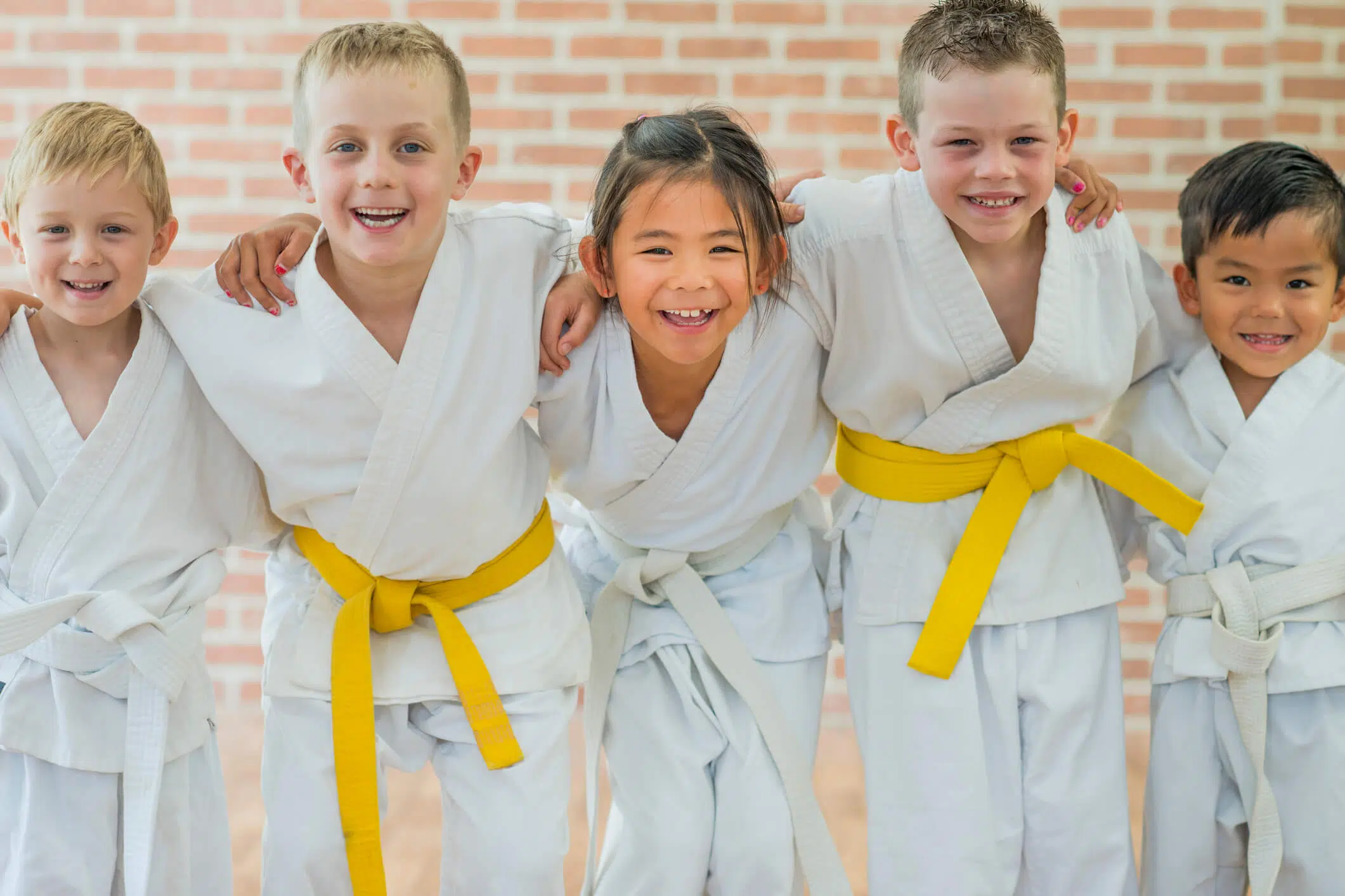 a group of kids at a martial arts studio