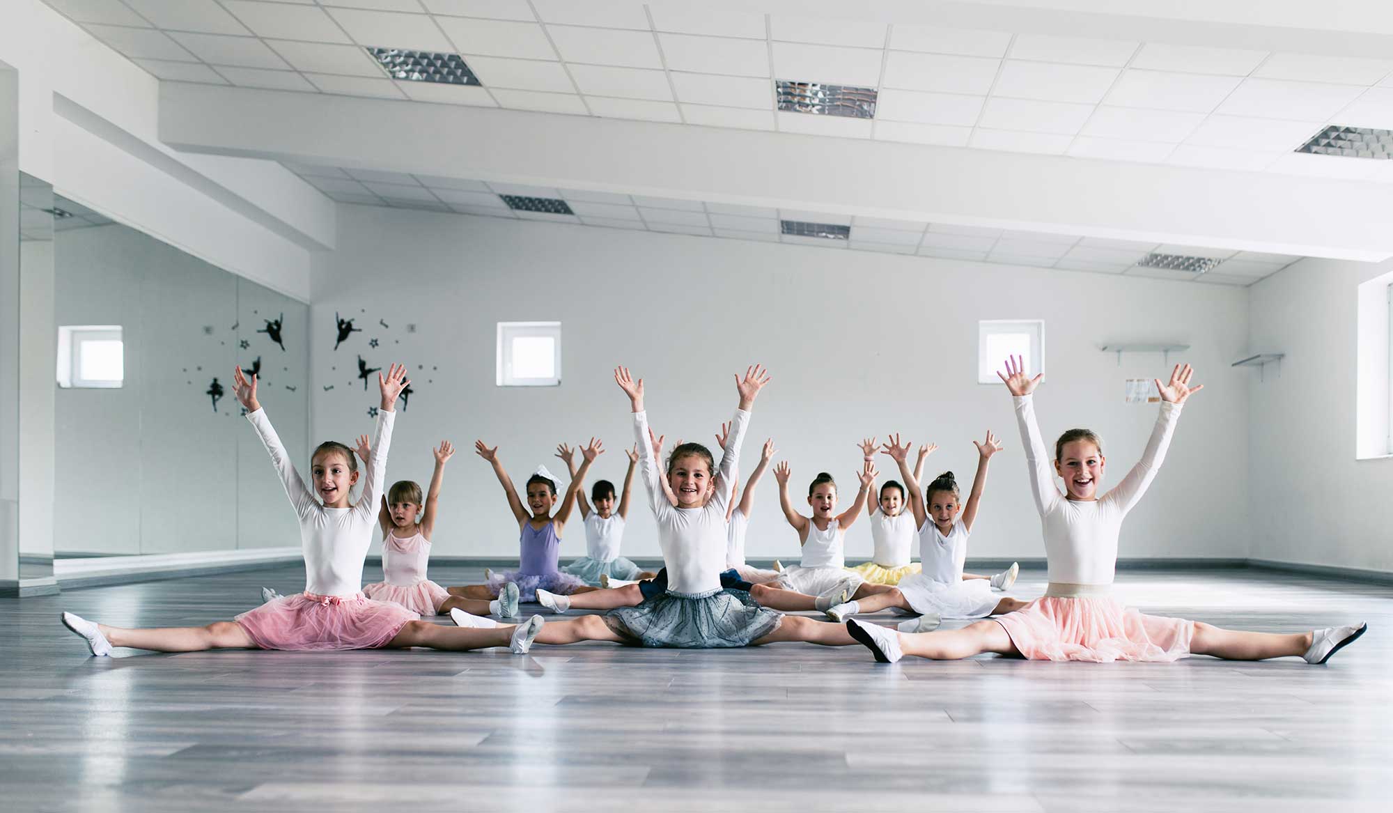 a group dance class with children on the dance floor