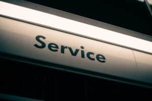 Black and white sign that reads Service
