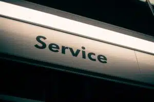 Black and white sign that reads Service