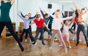 kids jumping and having fun in a dance class