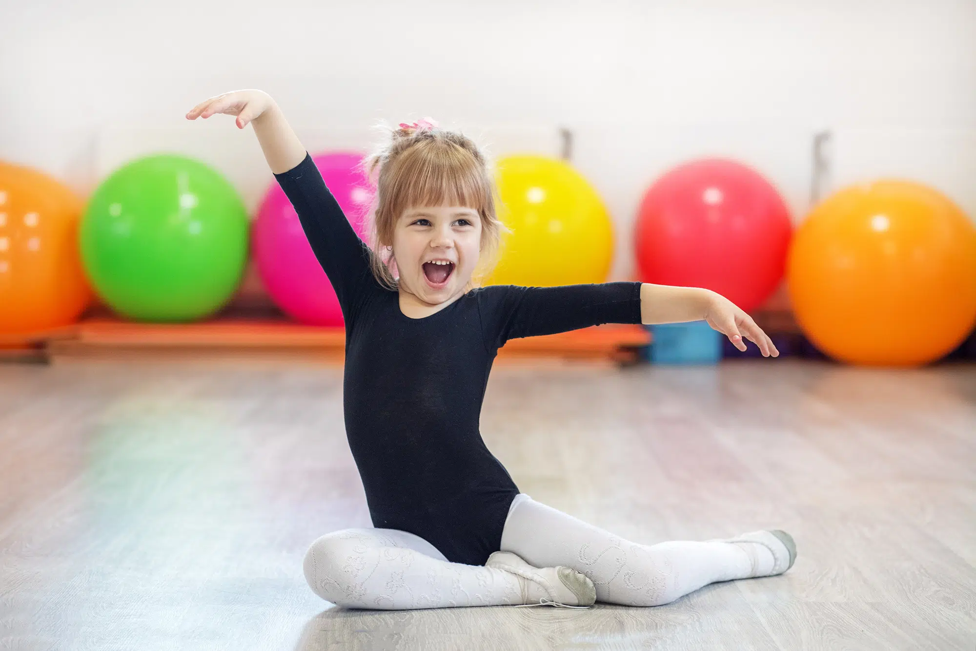 a young girl striking a dance pose