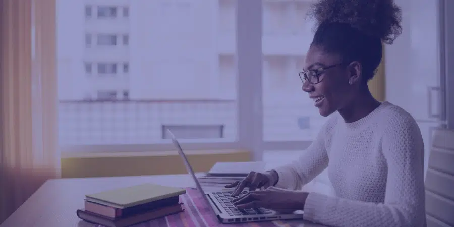 a person on a computer smiling