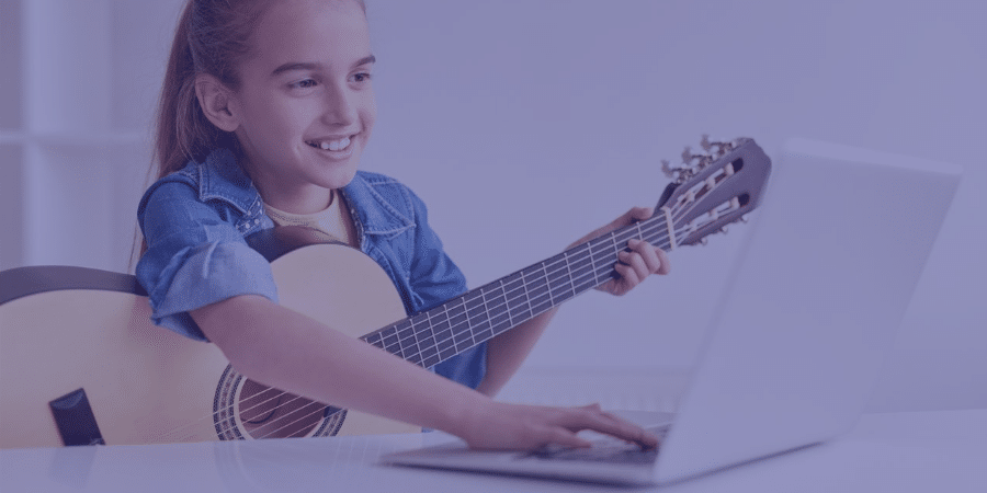a child playing a guitar